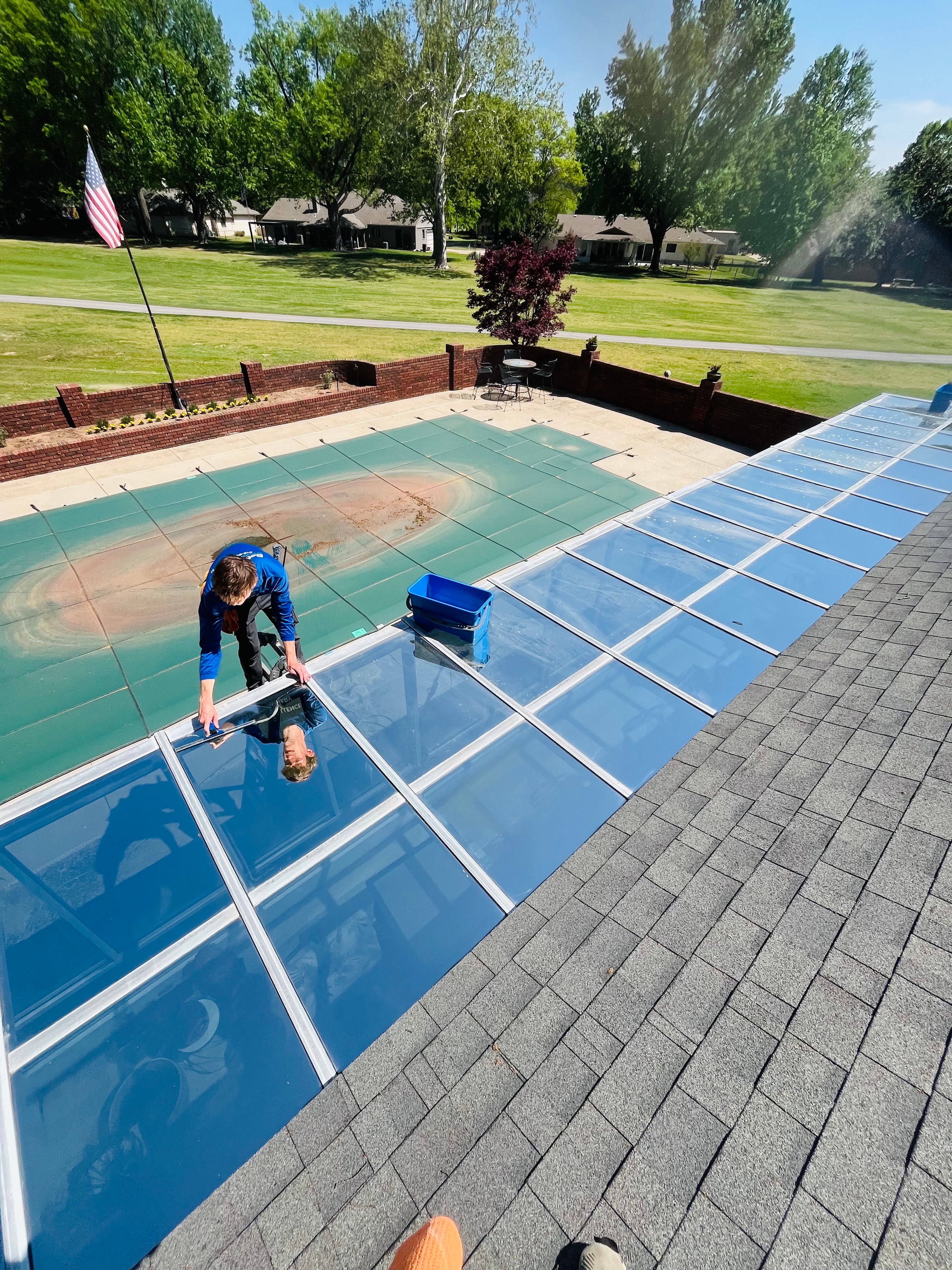 Professional window cleaning on modern building